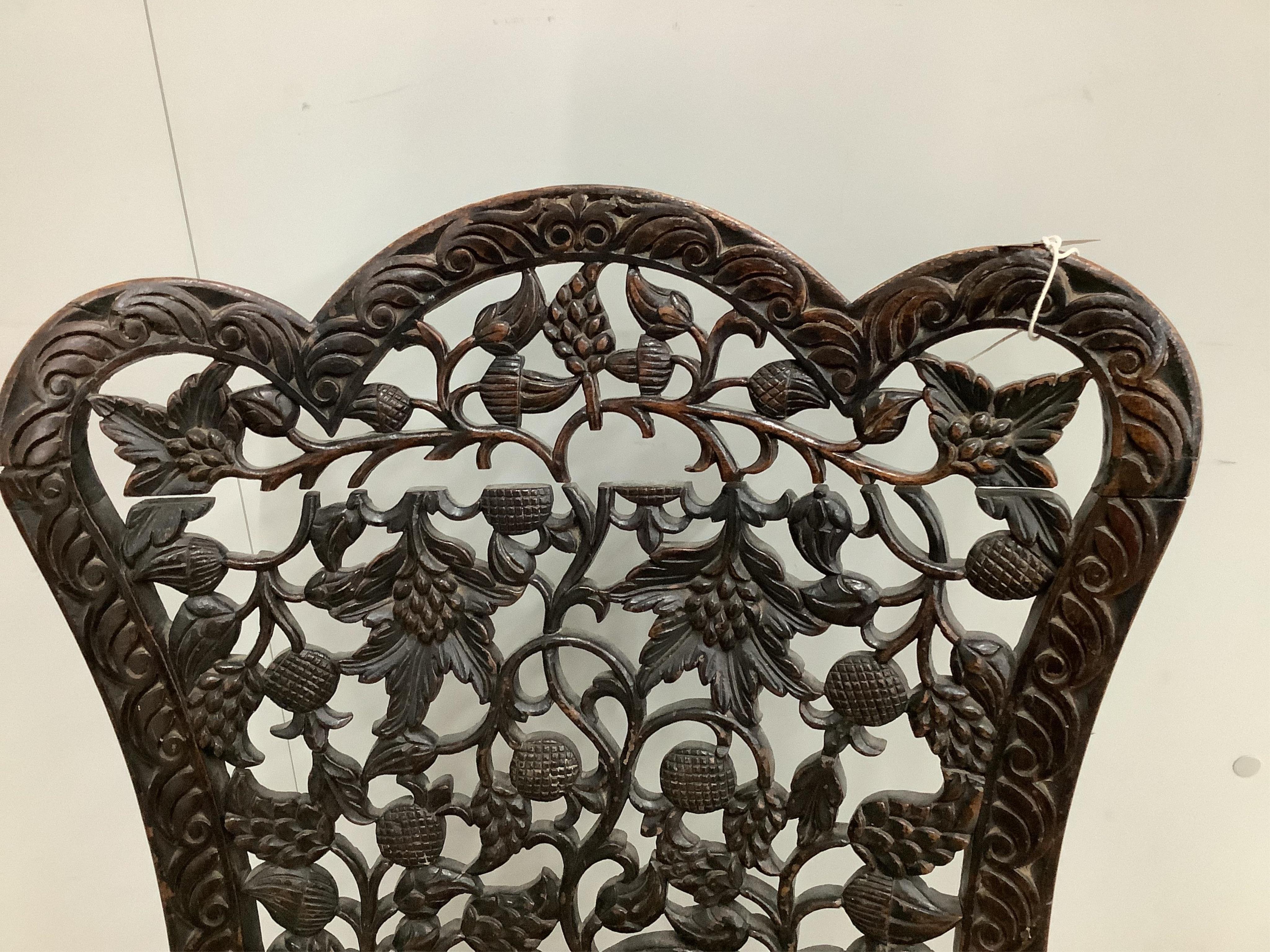An Anglo Indian carved hardwood side chair with tapestry seat, height 81cm